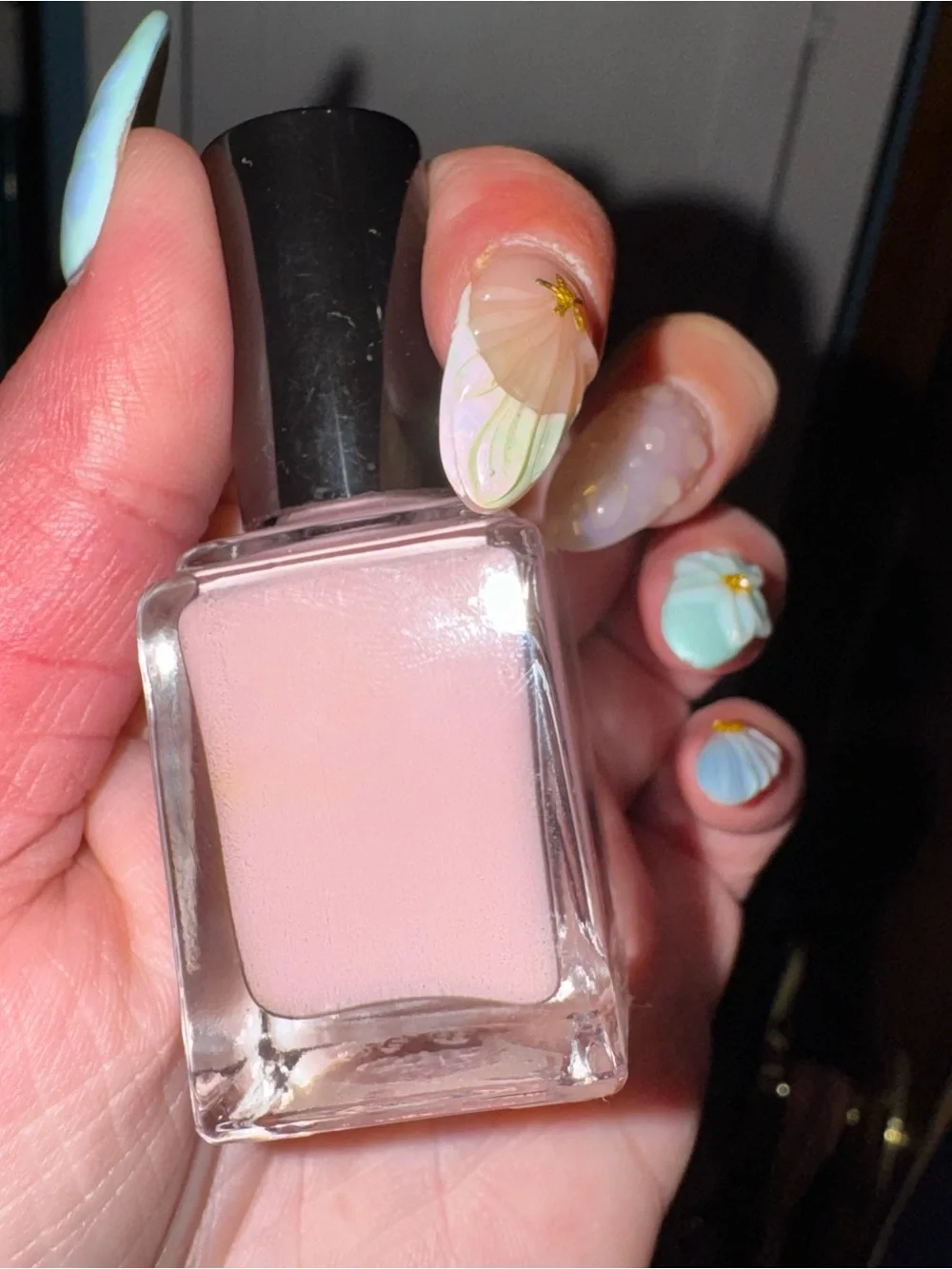 Pale pink nail polish